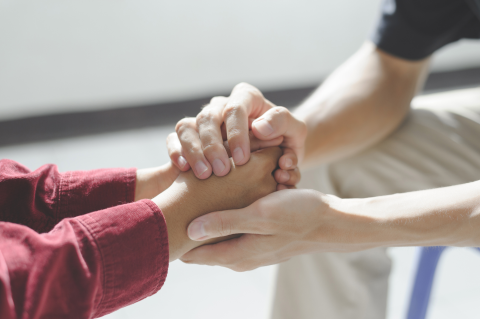 Two People Holding Hands during Grief and Loss Recovery
